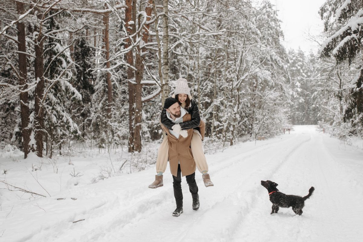 couple and dog in snow
