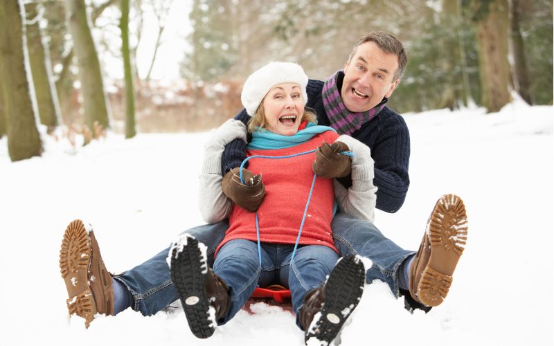 Couple sledding